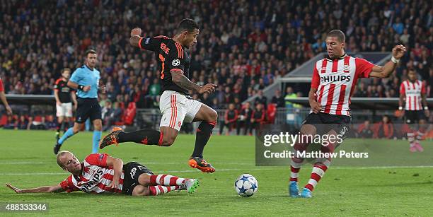 Memphis Depay of Manchester United in action with Jorrit Hendrix and Jeffrey Bruma of PSV Eindhoven during the UEFA Champions League match between...