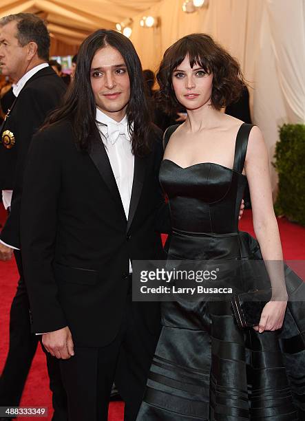 Designer Olivier Theyskens and actress Felicity Jones attend the "Charles James: Beyond Fashion" Costume Institute Gala at the Metropolitan Museum of...