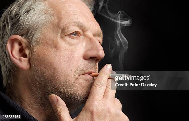 65-year old man smoking - smoking issues stock pictures, royalty-free photos & images
