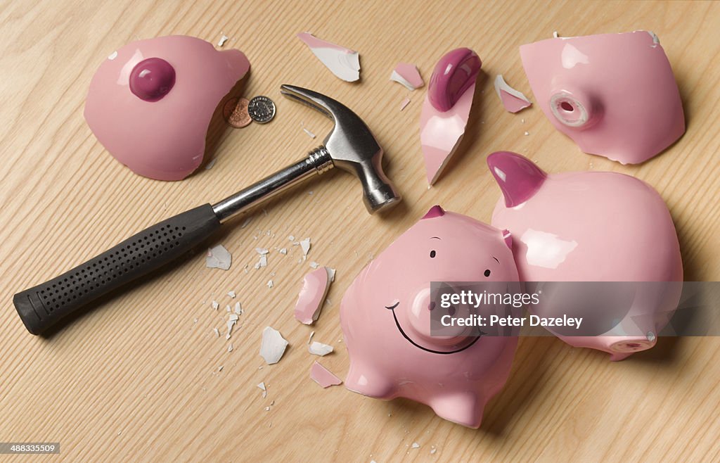Smashed piggy bank with change
