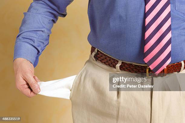 senior businessman with empty pocket - bolso imagens e fotografias de stock