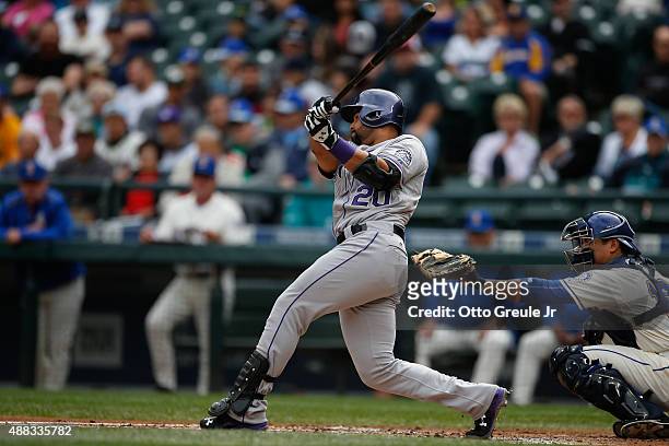 Wilin Rosario of the Colorado Rockies bats against the Seattle Mariners at Safeco Field on September 13, 2015 in Seattle, Washington.