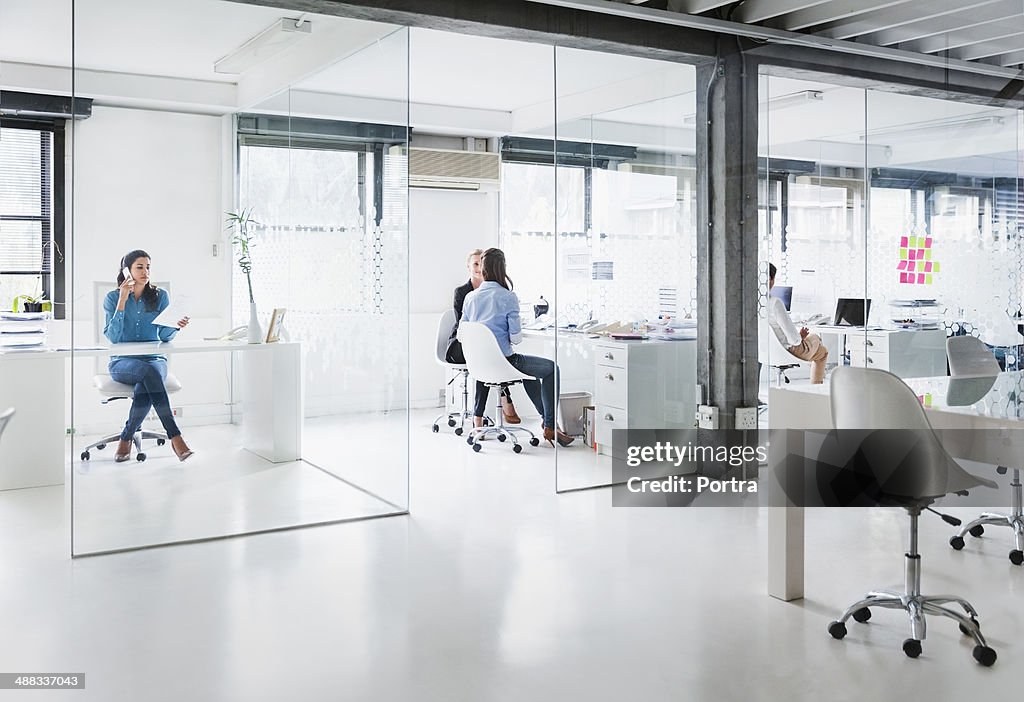 Bright modern office space with four women