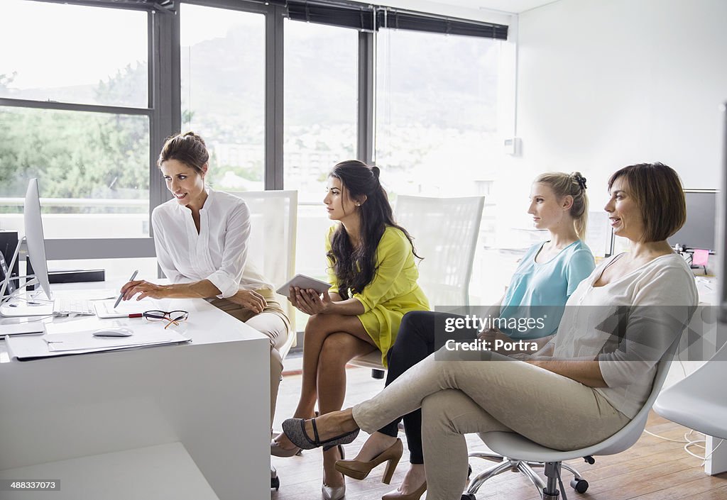 Businesswomen discussing projects in a meeting