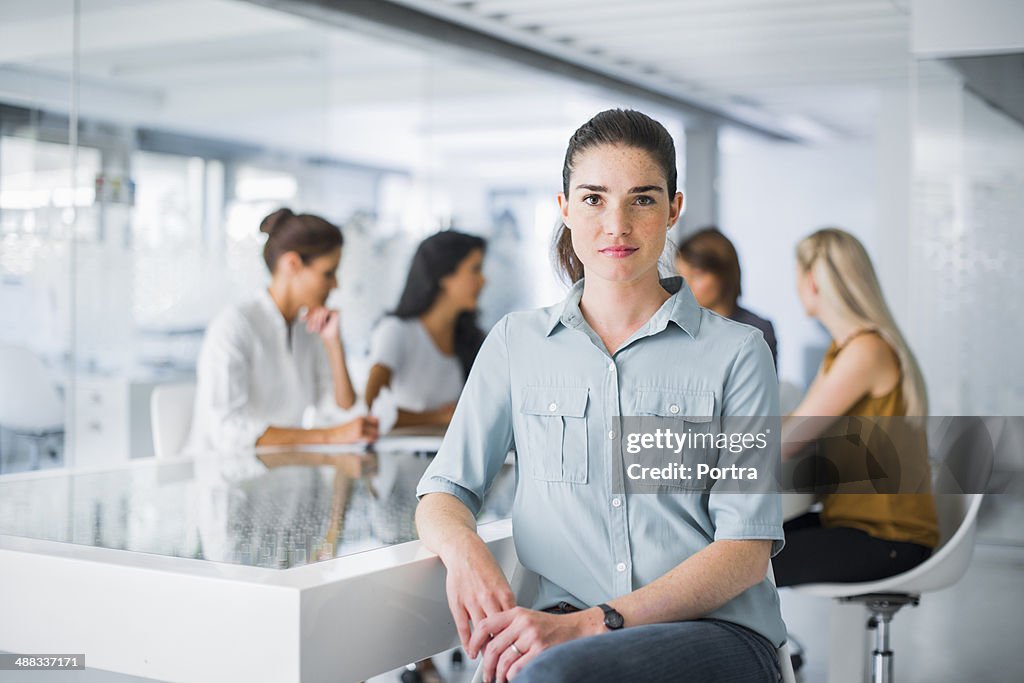 Portrait of a business woman sitting at desk