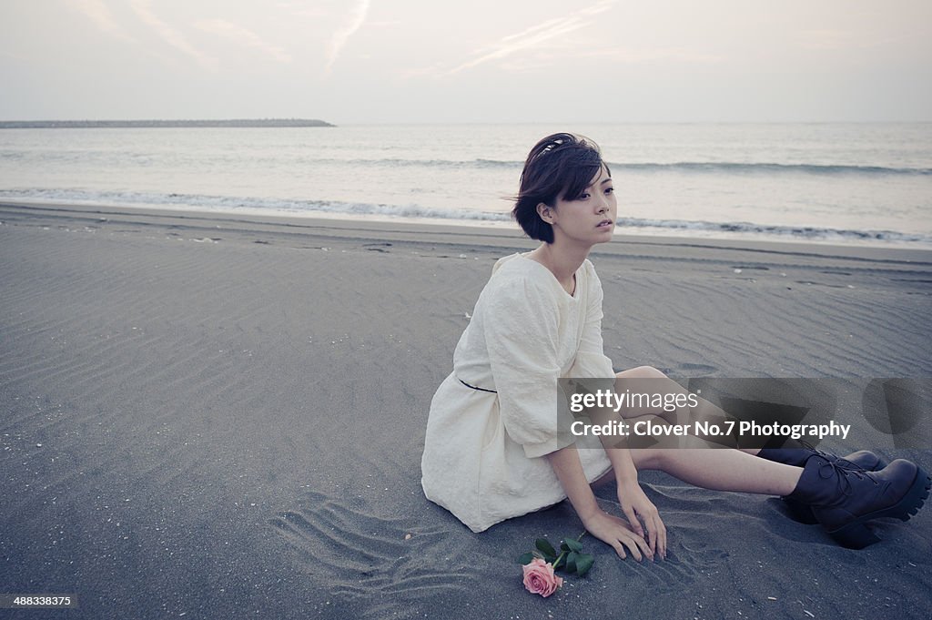 Girl sitting on the beach