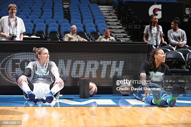 Lindsay Whalen and Seimone Augustus of the Minnesota Lynx stretch prior to the game against the Australian Opals during the WNBA pre-season game on...