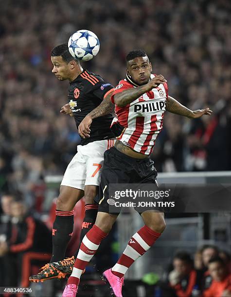 Manchester's Memphis Depay vies with PSV Eindhovens Jurgen Locadia during the UEFA Champions League Group B football match between PSV Eindhoven and...