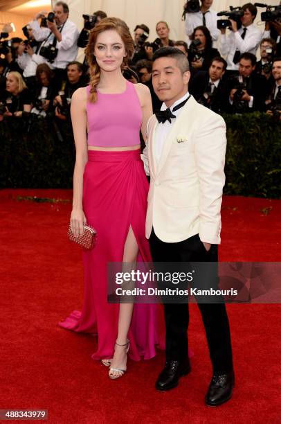 Actress Emma Stone and designer Thakoon Panichgul attend the "Charles James: Beyond Fashion" Costume Institute Gala at the Metropolitan Museum of Art...