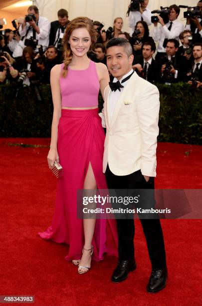 Actress Emma Stone and designer Thakoon Panichgul attend the "Charles James: Beyond Fashion" Costume Institute Gala at the Metropolitan Museum of Art...