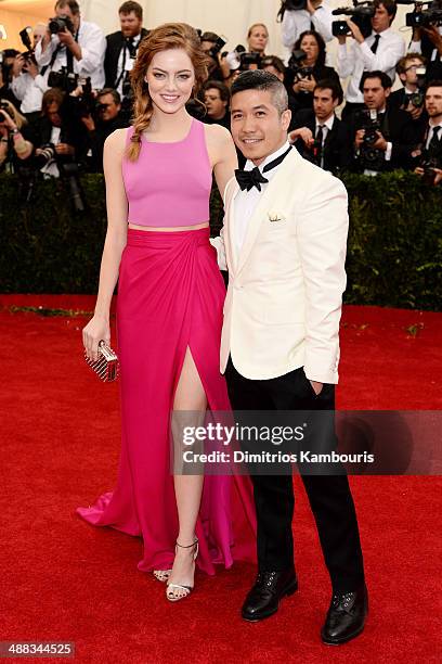 Actress Emma Stone and designer Thakoon Panichgul attend the "Charles James: Beyond Fashion" Costume Institute Gala at the Metropolitan Museum of Art...