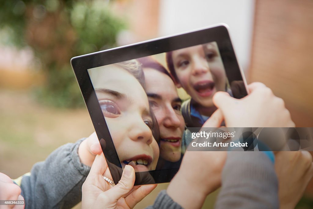 Mother with kids taking a selfie photo