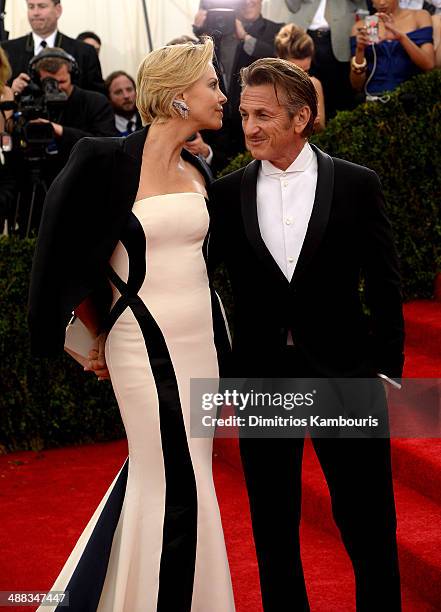 Charlize Theron and Sean Penn attend the "Charles James: Beyond Fashion" Costume Institute Gala at the Metropolitan Museum of Art on May 5, 2014 in...