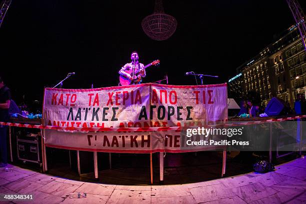 Street market vendors from all over Greece gather in Syntagma Square in front of the Greek Parliament, demanding that the Government votes against a...