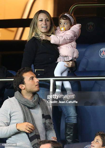 Angel Di Maria's wife and daughter, Jorgelina Cardoso and Mia Di Maria celebrate his goal during the UEFA Champions League match between Paris...