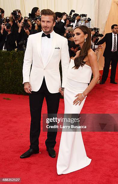 David Beckham and Victoria Beckham attend the "Charles James: Beyond Fashion" Costume Institute Gala at the Metropolitan Museum of Art on May 5, 2014...