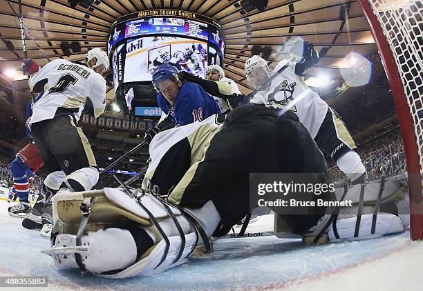 Marc-Andre Fleury of the Pittsburgh Penguins defends the net against J.T. Miller of the New York Rangers in Game Three of the Second Round of the...