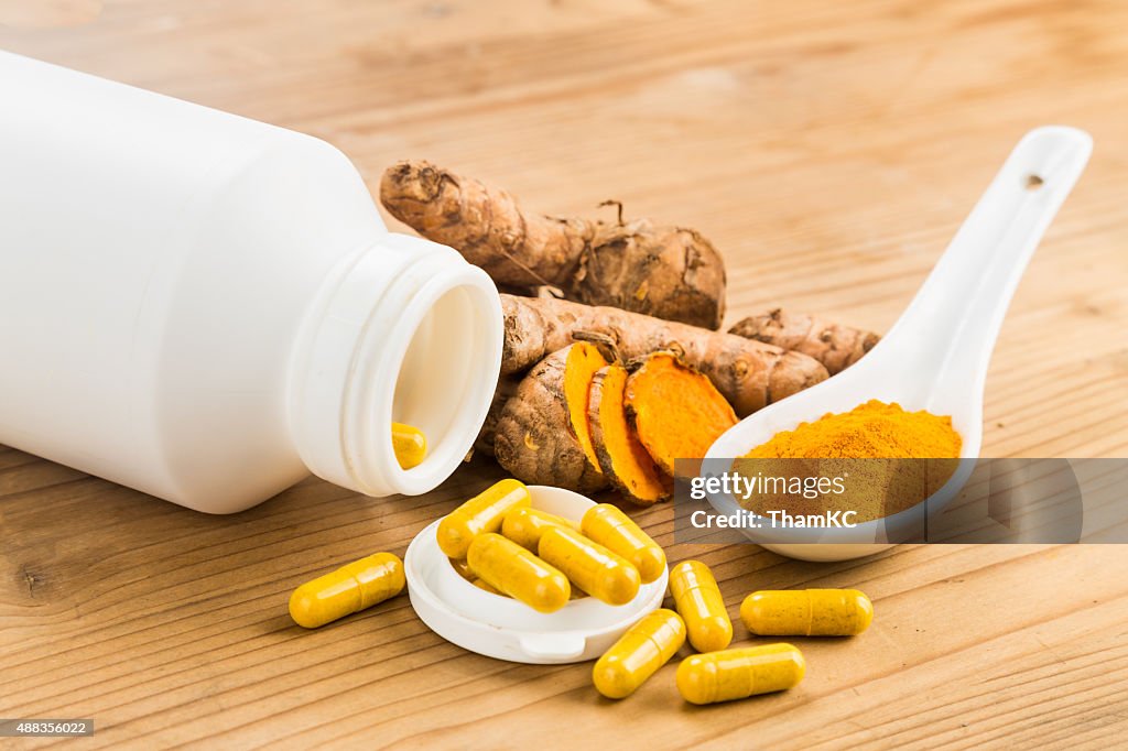 Homemade turmeric capsule from freshly grounded turmeric roots.