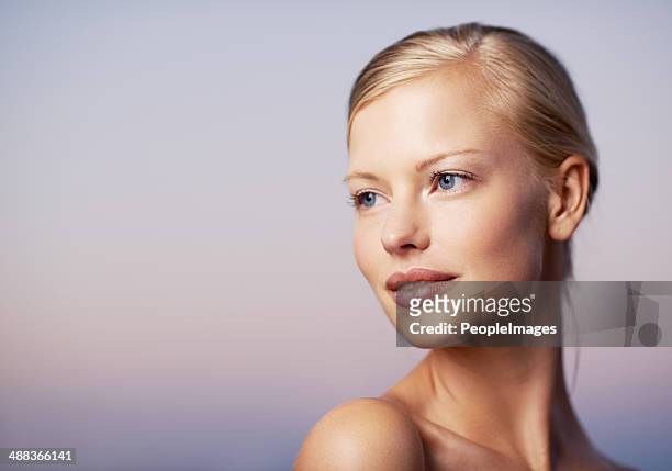 thinking about new beauty techniques - female blonde blue eyes stock pictures, royalty-free photos & images