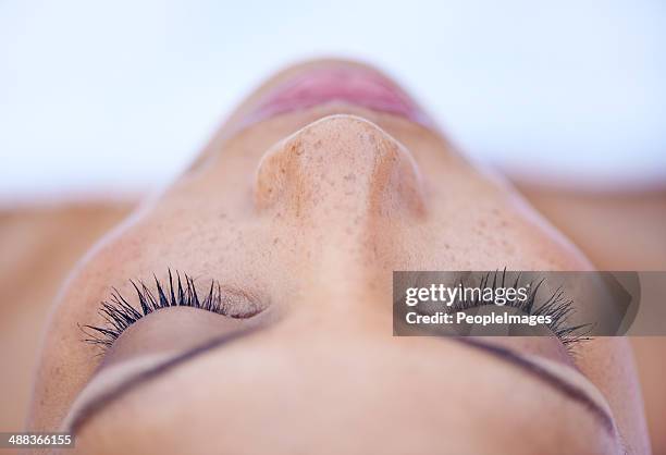 she's in a deeply relaxed state of mind - human nose stock pictures, royalty-free photos & images