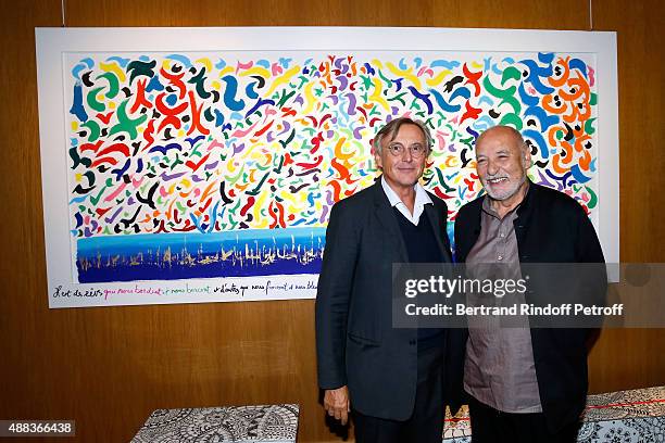 Pierre Passebon and Writer Tahar Ben Jelloun attend the 'Paintings Poems from Tahar Ben Jelloun - Furniture Scriptures from C.Saccomanno & O.Dayot' :...