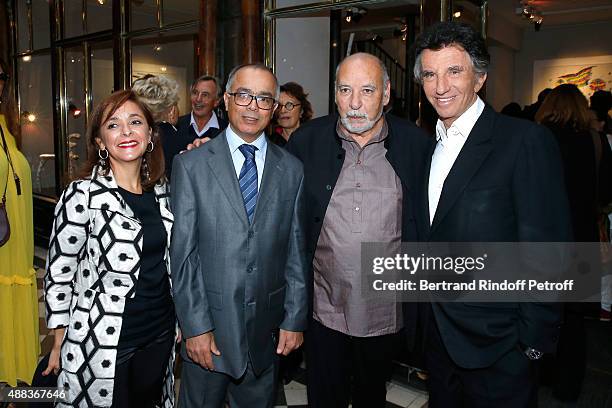 Morocco's ambassador in France Chakib Benmoussa with his wife, Writer Tahar Ben Jelloun and Jack Lang attend the 'Paintings Poems from Tahar Ben...