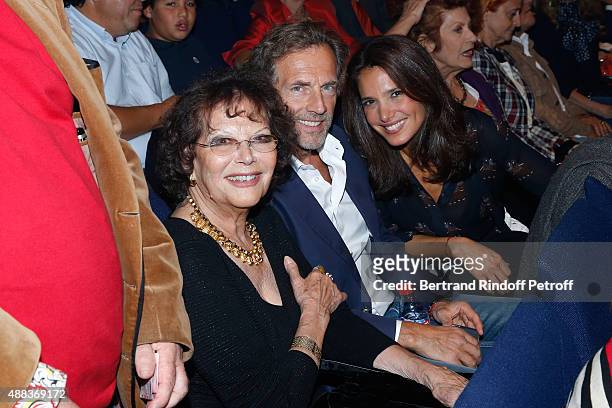 Actor Stepahne Freiss sitting between his wife Ursula and Actress Claudia Cardinale attend the Concert of singer Charles Aznavour at Palais des...