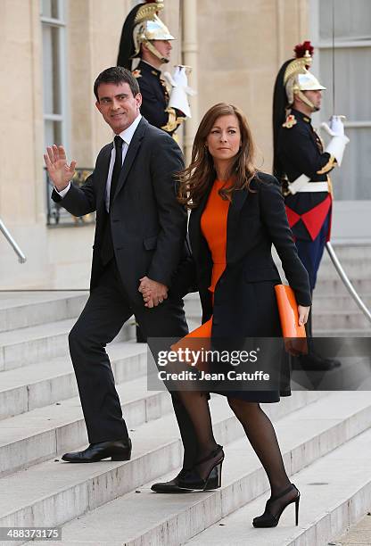 French Prime Minister Manuel Valls and his wife Anne Gravoin arrive at the State Dinner honoring Japanese Prime Minister at Elysee Palace on May 5,...