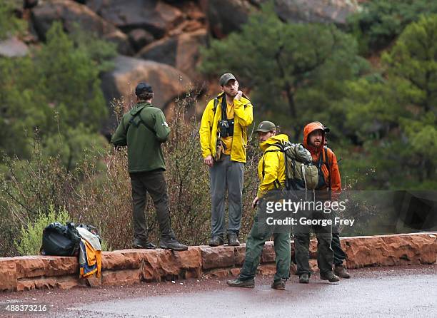 Search and rescue personal finish their day of searching Pine Creek in Zion's National Park for lost hikers on September 15, 2015 in Springdale,...