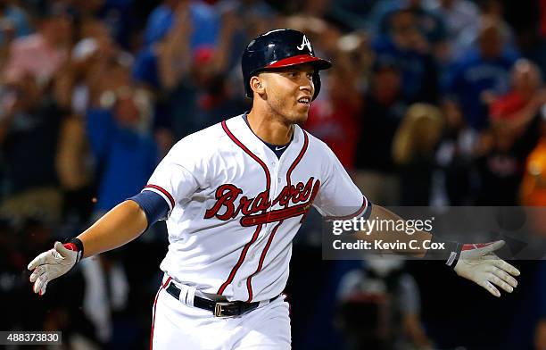 Andrelton Simmons of the Atlanta Braves reacts after hitting a walk-off RBI single in the ninth inning against the Toronto Blue Jays at Turner Field...