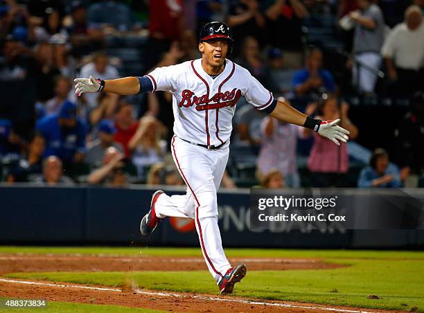 Andrelton Simmons of the Atlanta Braves reacts after hitting a walk-off RBI single in the ninth inning against the Toronto Blue Jays at Turner Field...