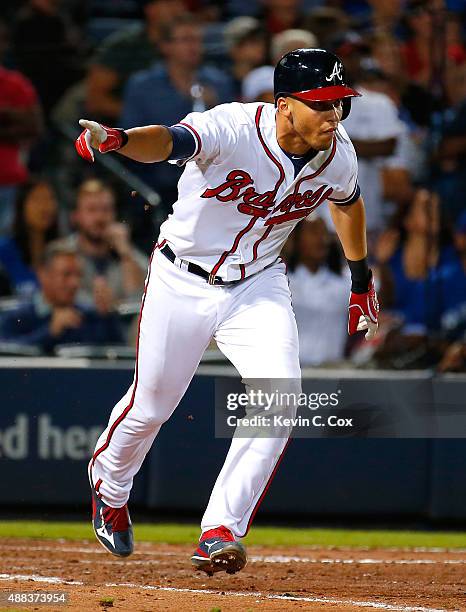 Andrelton Simmons of the Atlanta Braves reacts after hitting a walk-off RBI single in the ninth inning against the Toronto Blue Jays at Turner Field...