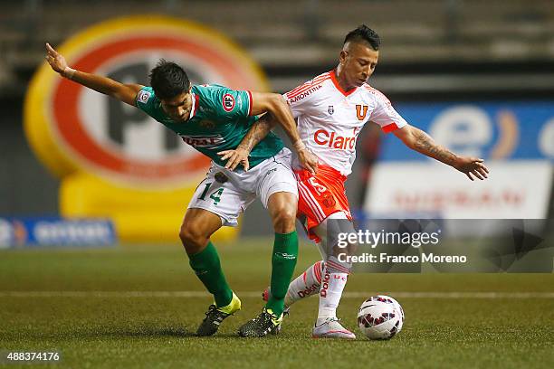 Leonardo Valencia of U de Chile fights for the ball with Juan Pablo Mino of Audax Italiano during a match between Audax Italiano and U de Chile as...