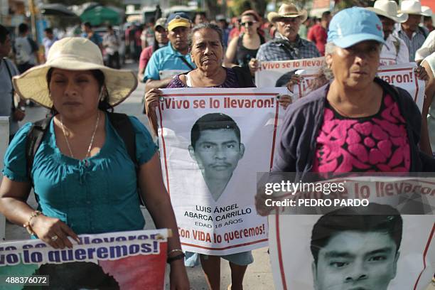 Relatives of the 43 missing students protest with their portraits at the central square in Chilpancingo, Guerrero State, Mexico on September 15,...