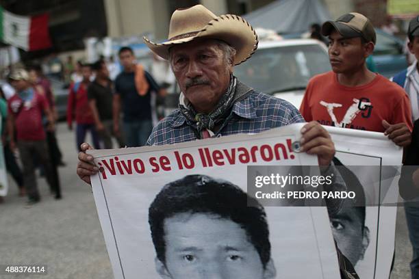 Relatives of the 43 missing students protest with their portraits at the central square in Chilpancingo, Guerrero State, Mexico on September 15,...