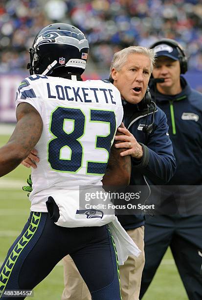 Head Coach Pete Carroll of the Seattle Seahawks talks with receiver Ricardo Lockette on the sidelines against the New York Giants during an NFL...