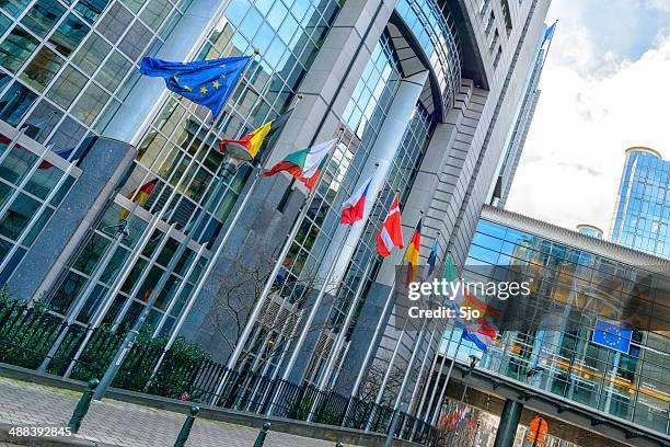 european parliament building in brussels - slovenian flag stock pictures, royalty-free photos & images
