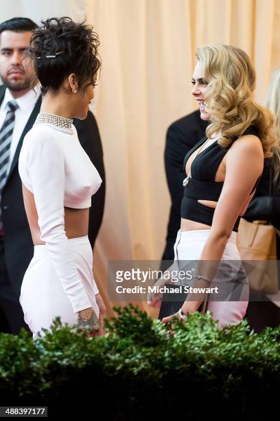 Singer Rihanna and model Cara Delevingne attend the "Charles James: Beyond Fashion" Costume Institute Gala at the Metropolitan Museum of Art on May...