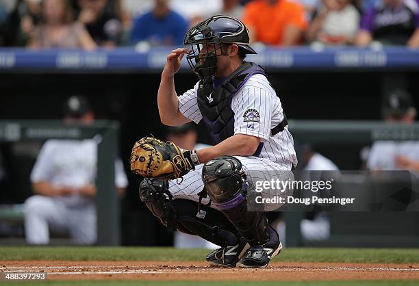 Catcher Michael McKenry of the Colorado Rockies backs up the plate against the New York Mets at Coors Field on May 4, 2014 in Denver, Colorado. The...