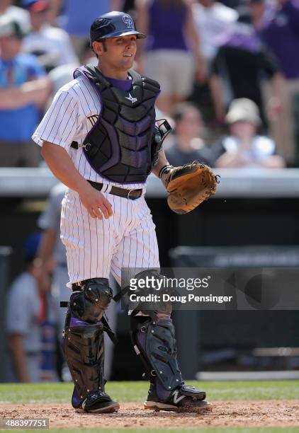 Catcher Michael McKenry of the Colorado Rockies backs up the plate against the New York Mets at Coors Field on May 4, 2014 in Denver, Colorado. The...