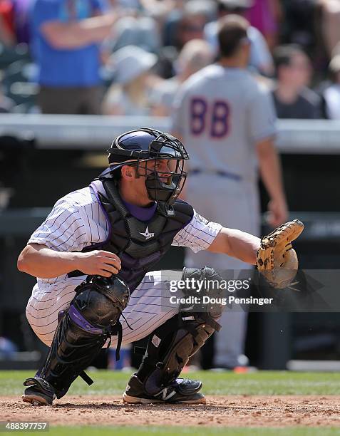 Catcher Michael McKenry of the Colorado Rockies backs up the plate against the New York Mets at Coors Field on May 4, 2014 in Denver, Colorado. The...