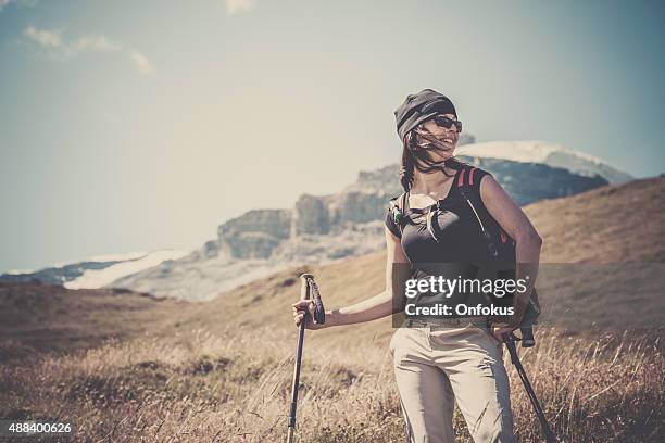 woman hiking in the valais canton, switzerland - grande dixence dam stock pictures, royalty-free photos & images