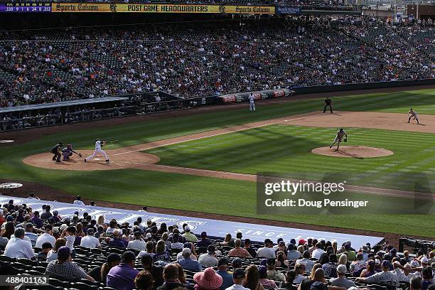 Justin Morneau of the Colorado Rockies hits a solo home run off of Jeurys Familia of the New York Mets in the ninth inning at Coors Field on May 4,...