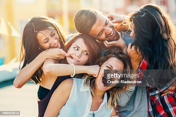 roof party - women being strangled stock pictures, royalty-free photos & images