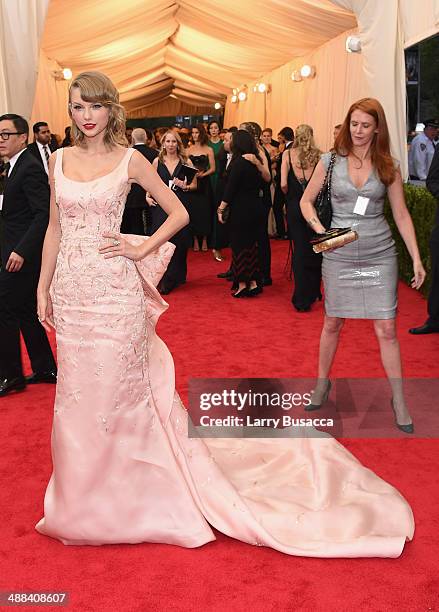 Singer Taylor Swift attends the "Charles James: Beyond Fashion" Costume Institute Gala at the Metropolitan Museum of Art on May 5, 2014 in New York...