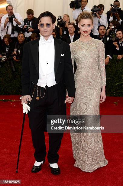 Actors Johnny Depp and Amber Heard attend the "Charles James: Beyond Fashion" Costume Institute Gala at the Metropolitan Museum of Art on May 5, 2014...