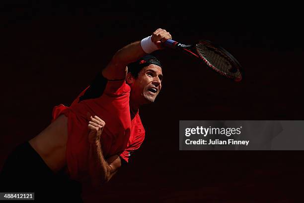 Tommy Haas of Germany serves to Igor Sijsling of Holland during day four of the Mutua Madrid Open tennis tournament at the Caja Magica on May 6, 2014...