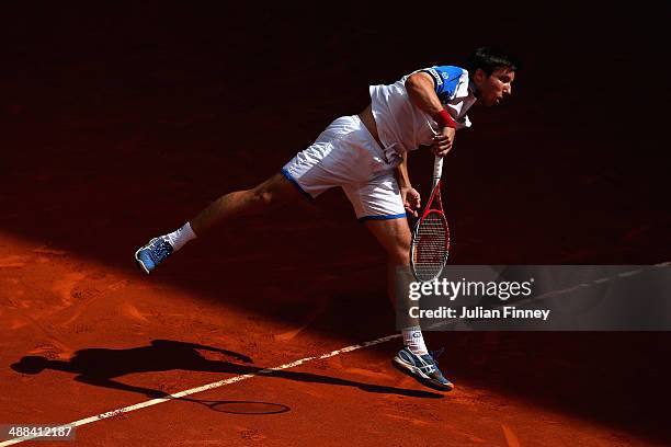 Igor Sijsling of Holland serves to Tommy Haas of Germany during day four of the Mutua Madrid Open tennis tournament at the Caja Magica on May 6, 2014...