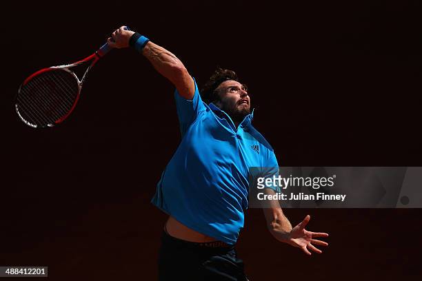 Ernests Gulbis of Latvia in action against Jerzy Janowicz of Poland during day four of the Mutua Madrid Open tennis tournament at the Caja Magica on...