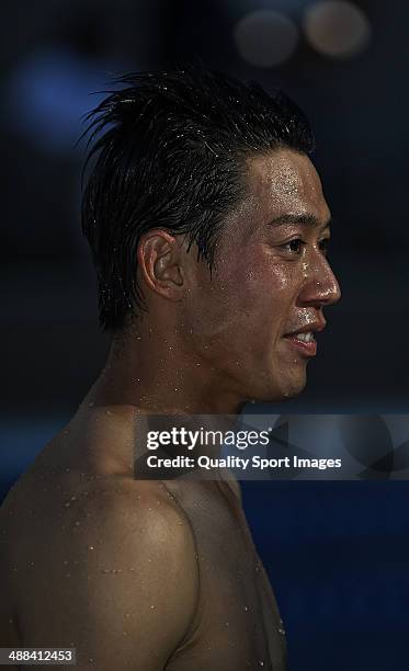 Kei Nishikori of Japan celebrating his victory into the club's pool after his victory against Santiago Giraldo of Colombia after day eight of the ATP...